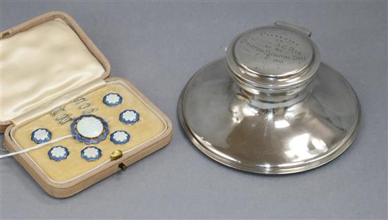 A seven piece enamelled white metal button and brooch set stamped sterling and a George V silver capstan inkwell 12.5cm